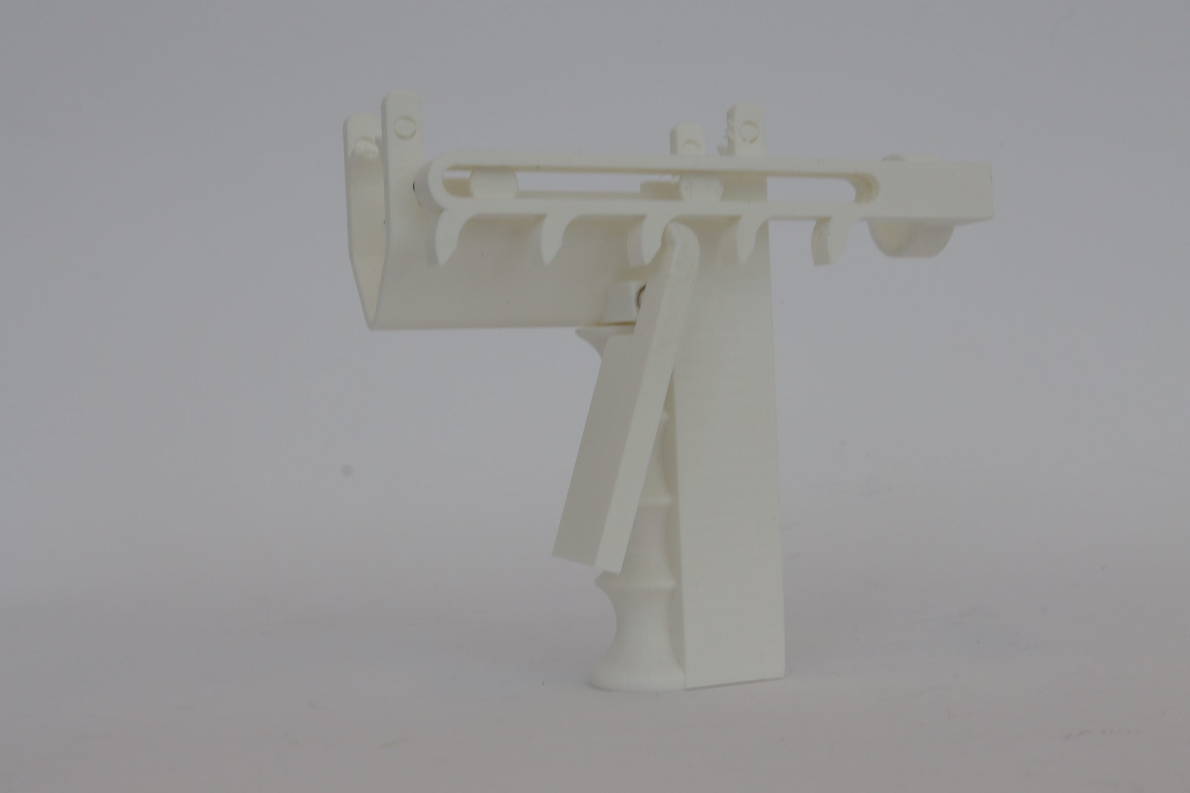 Total Ergonomics pistol grip prototype — distributes force across palm and fingers